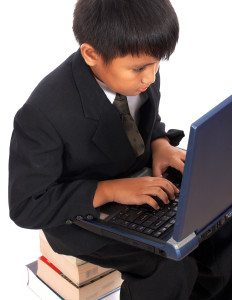 Boy Doing His Homework On His Computer
